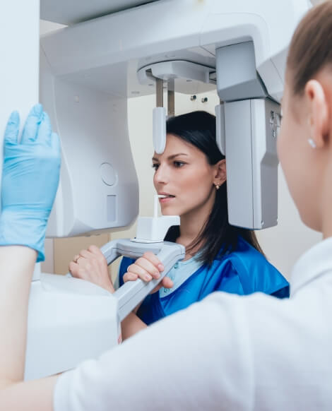 Patient getting scans of her jaw with advanced T M J technology