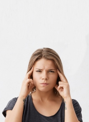 Frustrated woman touching her temples