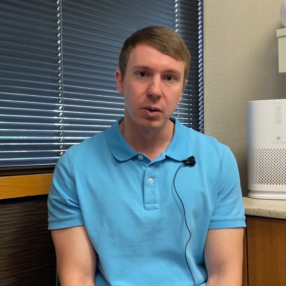 Man in light blue polo shirt