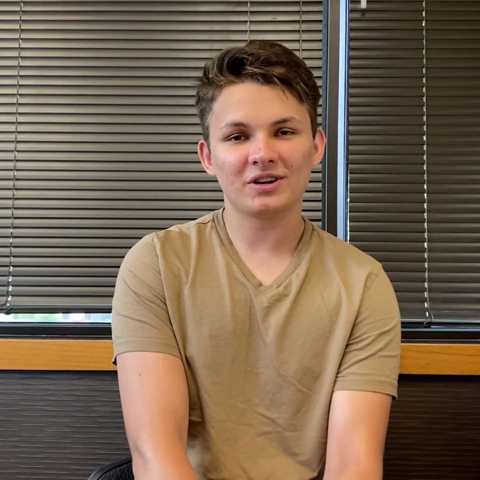 Young man in light brown T shirt