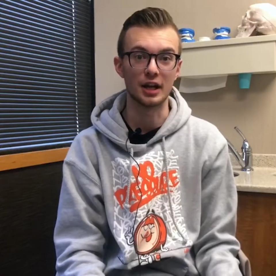 Young man in gray hoodie