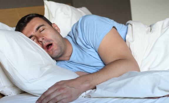 Man sleeping on his side with mouth open